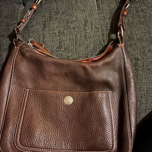 Coach shoulder bag with a little wear and tear.